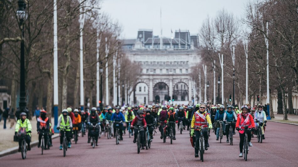 LCC protest ride with woman leading large group of people on bikes